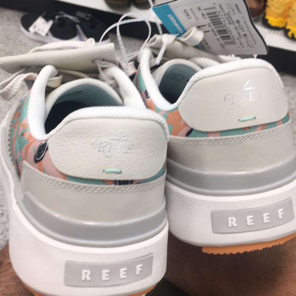 Reef Golf shoes on shore pebble size 11